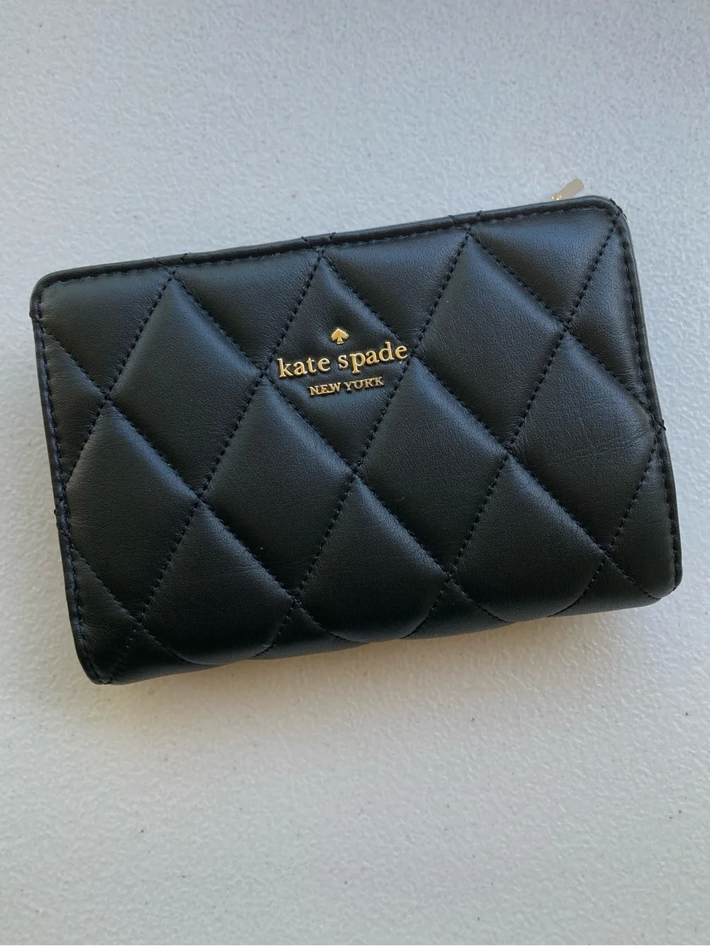 Kate Spade New York Carey Medium Compact Bifold Wallet in Black Quilted Leather